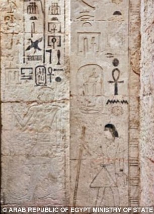 The large door covered in hieroglyphs 